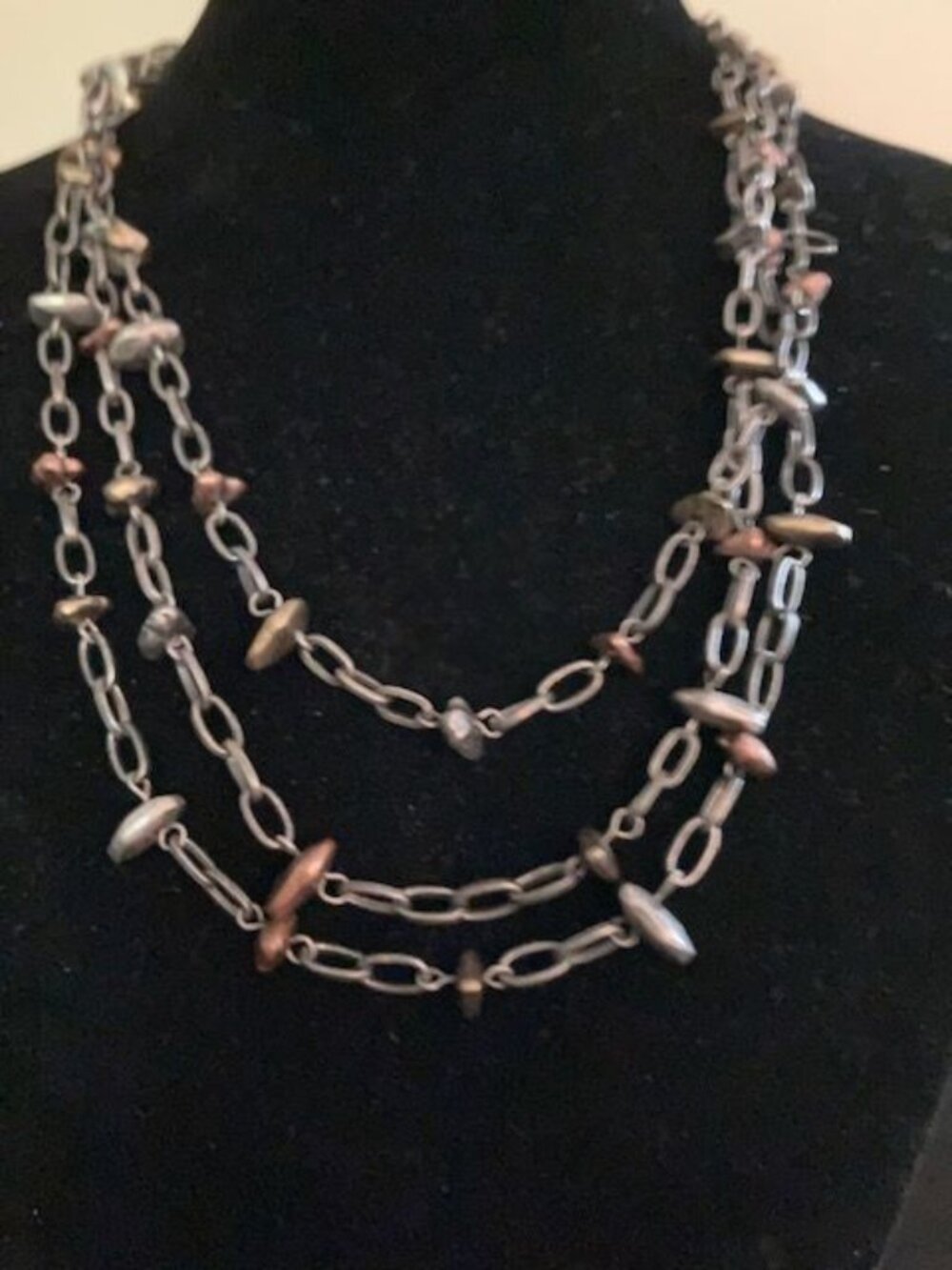 Triple Stranded Metallic Beaded Necklace on Gray Chain